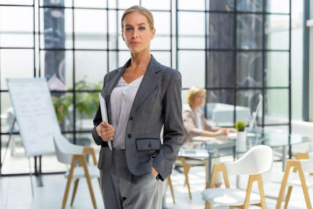 Face of beautiful woman on the background of business peopleの写真素材