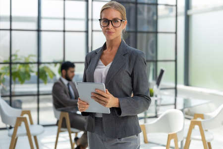 Face of beautiful woman on the background of business peopleの写真素材