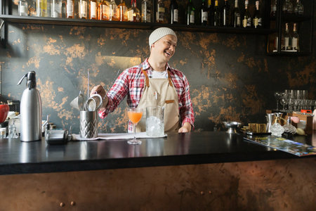 Barman at work, preparing cocktails. concept about service and beverages