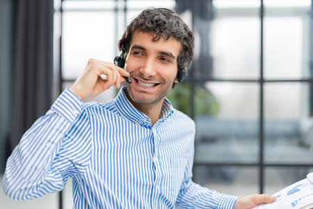 Smiling friendly handsome young male call centre operator