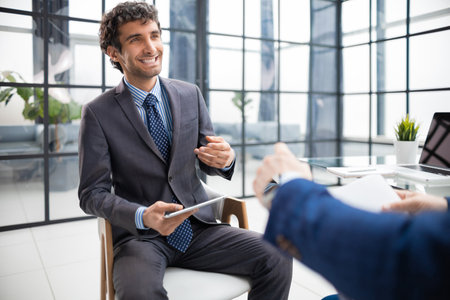 Job interview with the employer, businessman listen to candidate answersの写真素材
