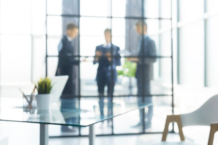 Blurred image of business people standing in the office.の写真素材