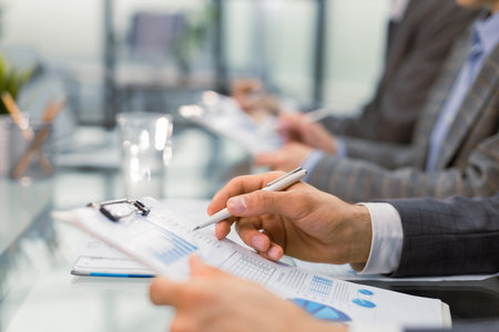 Business adviser analyzing financial figures denoting the progress in the work of the companyの写真素材