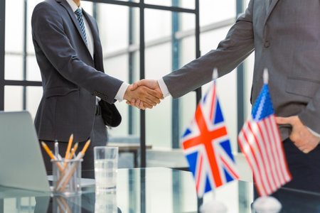 United Kingdom and American leaders shaking hands on a deal agreementの写真素材
