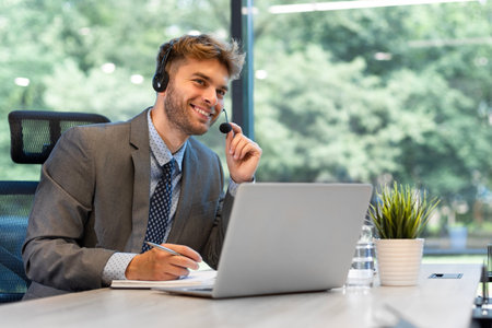 Smiling friendly handsome young male call centre operator