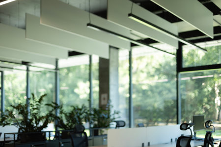 Empty modern coworking office environment with panoramic windows.の写真素材