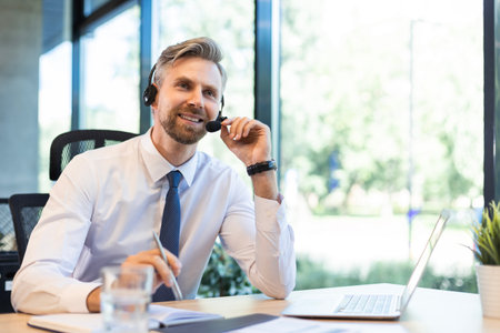Portrait of call center worker. Smiling customer support operator at work.