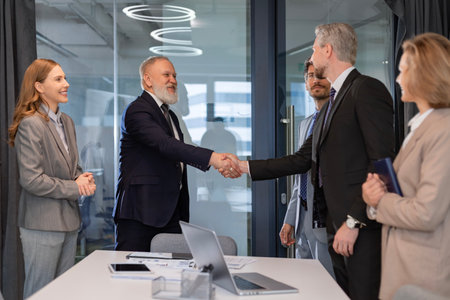 Businessmen shaking hands during a meeting