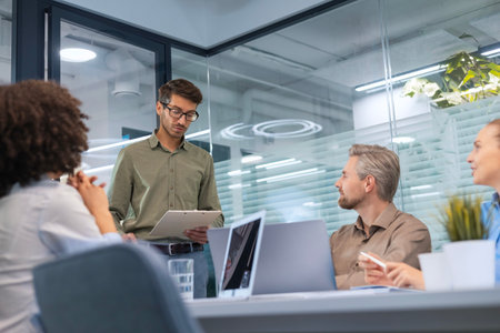 Business meeting - manager discussing work with his colleagues