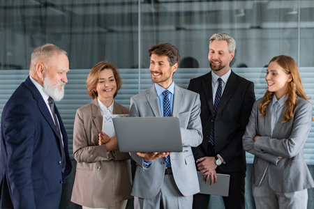 Business meeting - manager discussing work with his colleaguesの写真素材