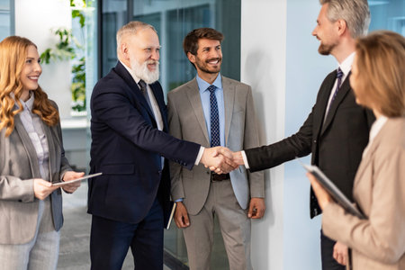Businessmen shaking hands during a meetingの写真素材