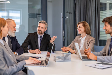 Group of modern people using modern technologies while working in the modern office.
