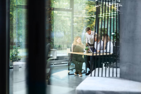 Business office with blurred people casual wear, with blurred bokeh backgroundの写真素材