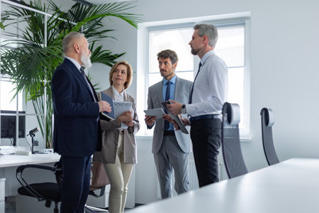 Business meeting - manager discussing work with his colleagues