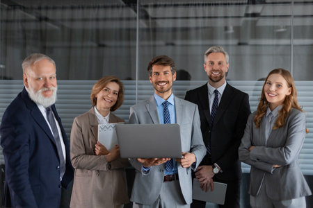 Business meeting - manager discussing work with his colleaguesの写真素材