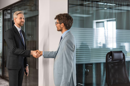 Businessmen shaking hands during a meetingの写真素材
