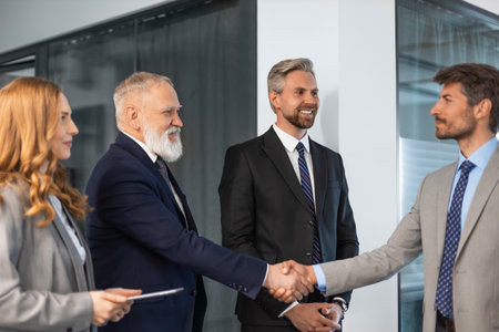 Businessmen shaking hands during a meetingの写真素材