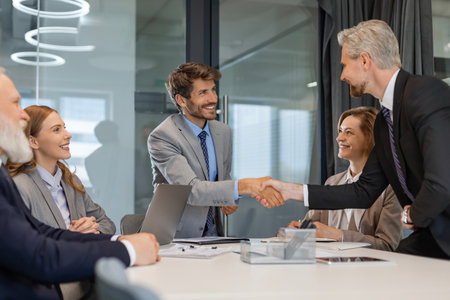 Businessmen shaking hands during a meetingの写真素材