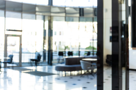 Blurred background of a bright and spacious modern office.の写真素材