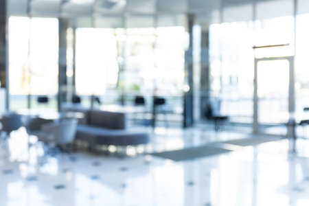 Blurred background of a bright and spacious modern office.の写真素材