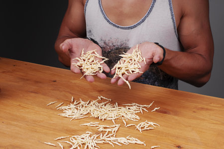Pasta of firm grades in hands. Italian pasta.