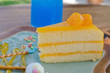 Orange cake on vintage plate.の写真素材
