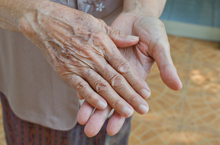 Old senior woman hands wrinkled skin.の写真素材