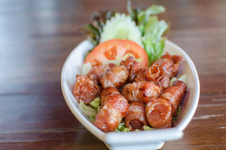 Fried pork wrapped in bacon.の写真素材