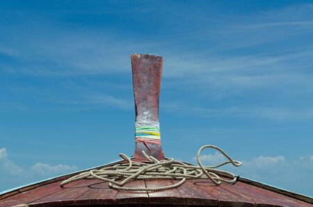 concept of summer traveling with wooden boat and blue sky .の写真素材