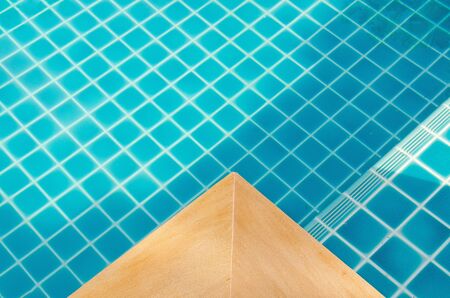 swimming pool with sunny reflections, travel and vacation conceptの写真素材