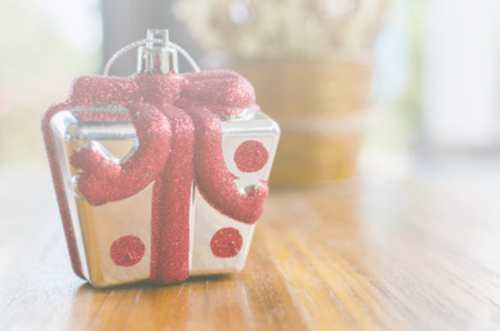 Blurred christmas gifts on wood table