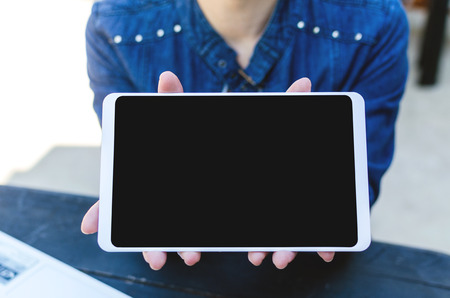 Tablet computer in woman hand.の写真素材