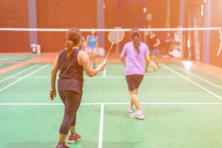 Blurred woman players badminton.の写真素材