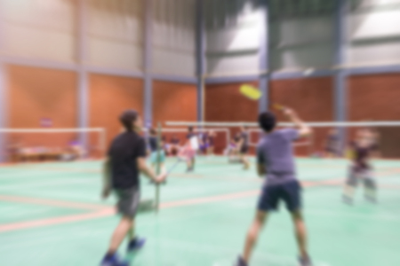 badminton court with blurred background woman playing badminton.の写真素材