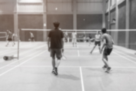 badminton court with blurred background woman playing badminton.の写真素材