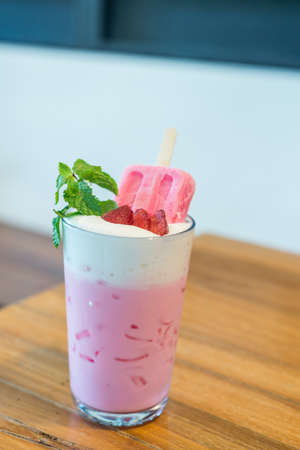 strawberry ice cream with pink milk in glassの写真素材