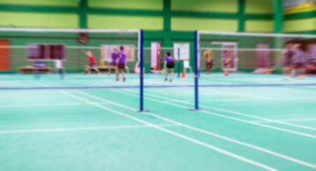badminton court with burred kid players badminton.の写真素材