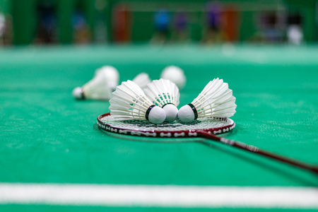 badminton shuttlecock and racket on court, selective focus.の写真素材