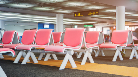 Row of seats in departure area in airport terminal.のeditorial素材