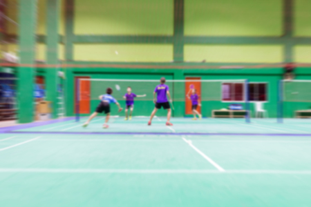 badminton court with burred kid players badminton.の写真素材