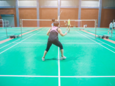 badminton court with blurred players badminton.の写真素材