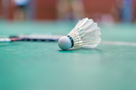 shuttlecock and badminton racket in  court.の写真素材