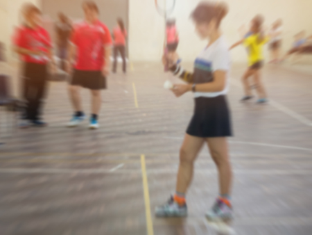 blurred background badminton player in badminton court.の写真素材