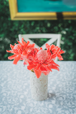 Torch ginger flower in vase, vintage tone.の写真素材