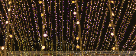 blurred christmas background with light bokeh.の写真素材