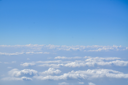 The sky with clouds view from airplane window.の写真素材