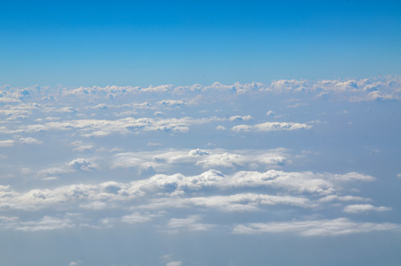 The sky with clouds view from airplane window.の写真素材