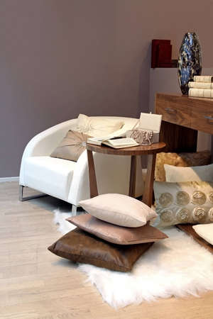 Modern interior quiet corner with armchair and open book on coffee tableの写真素材