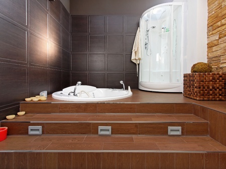 Modern bathroom interior with hydromassage bathtub and showerの写真素材