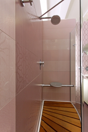 View from inside modern shower cabin with wooden floorの写真素材